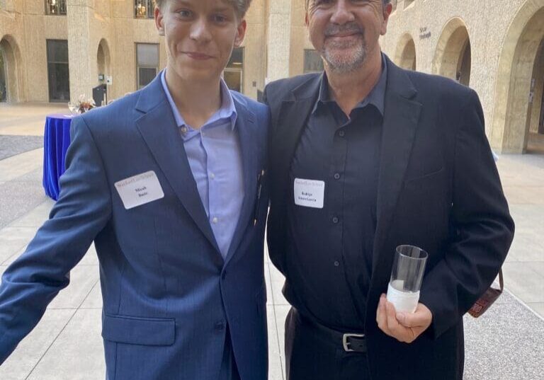 Two men in suits at Stanford Law School.